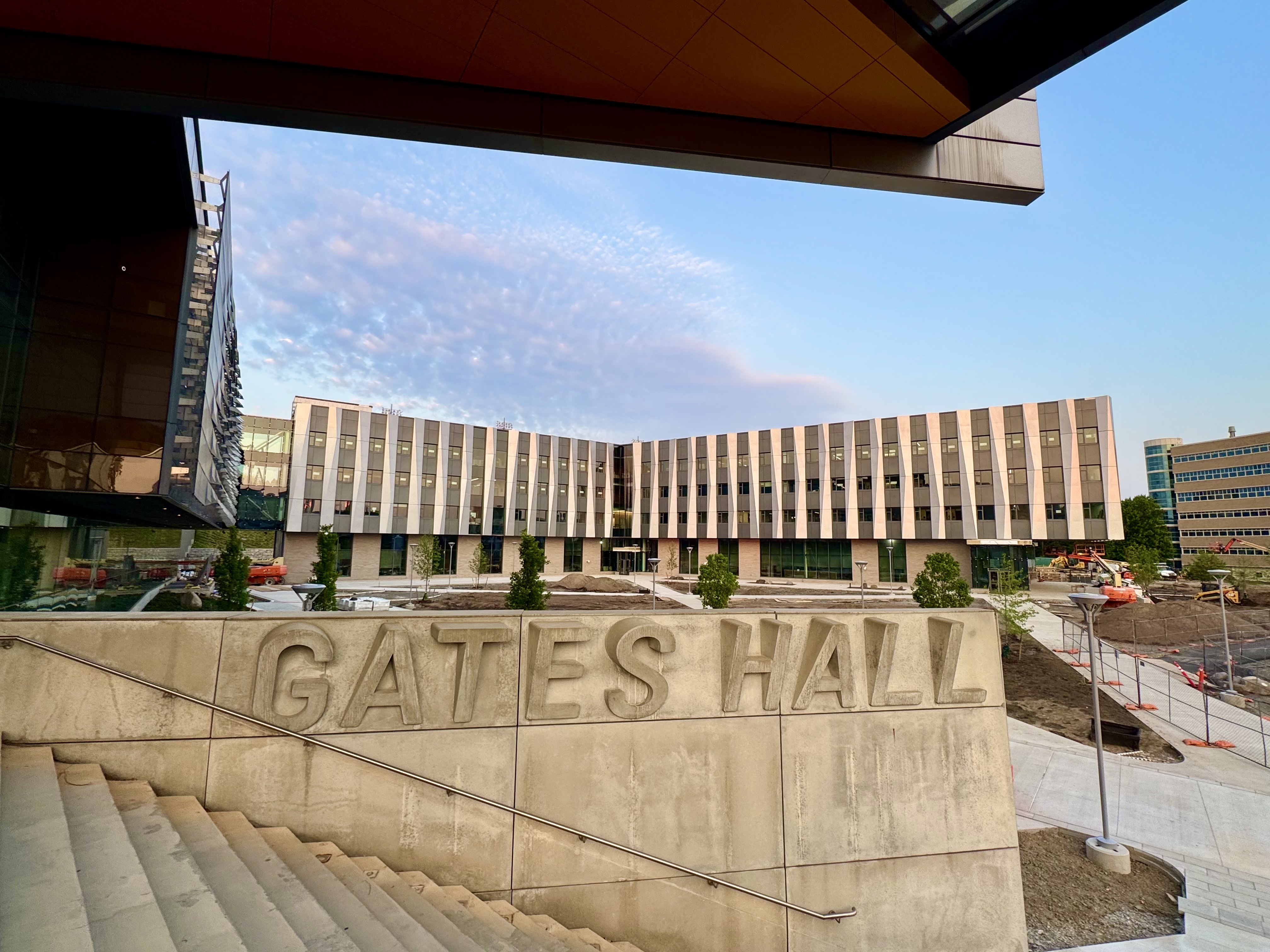 A color photo showing the new building for Cornell Bowers from Gates Hall