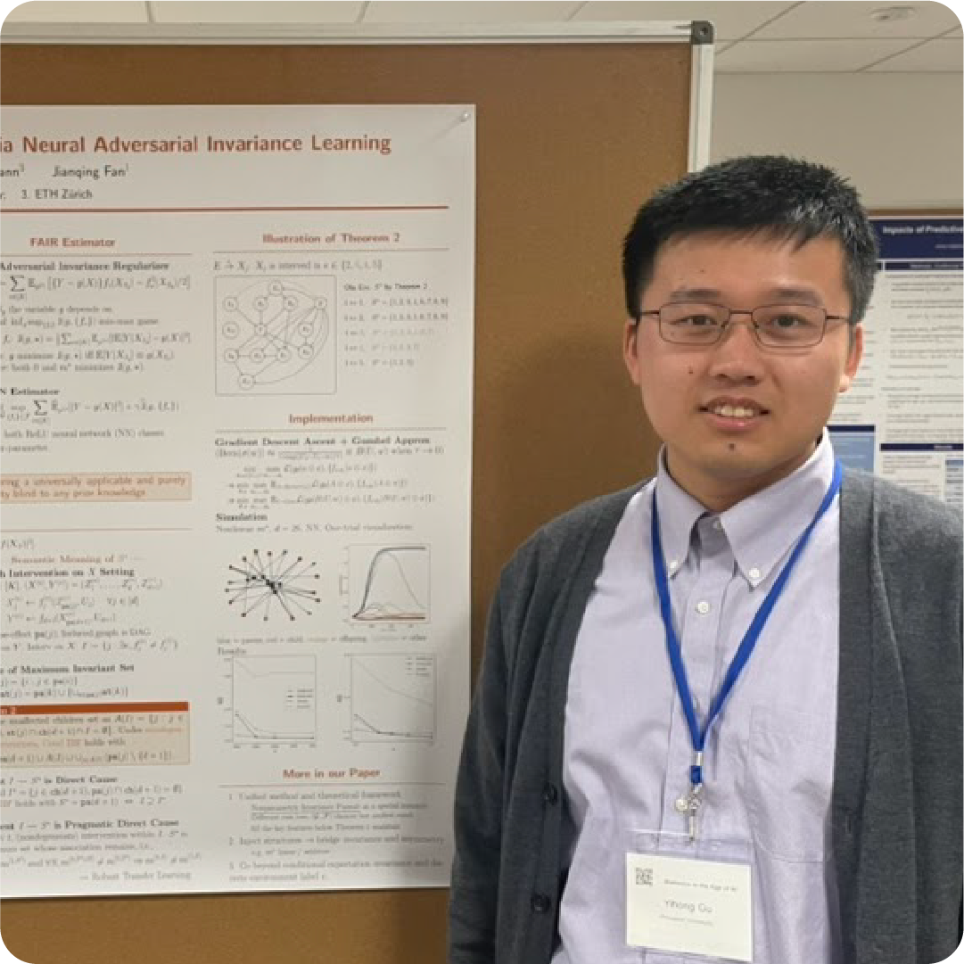 A color photo of a man standing in front of a poster board presentation about his research.