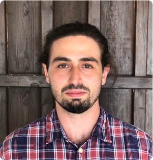 A color photo of a man with a beard.