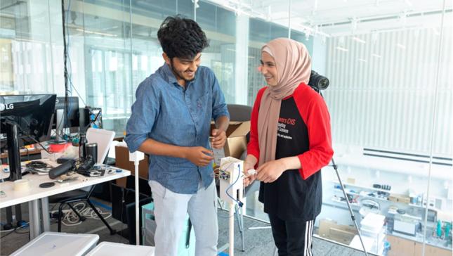 Two students working on a project.