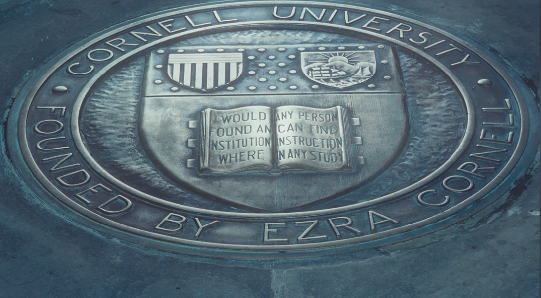 A closeup of the book portion of the Cornell Seal at Myron Taylor Hall: "I would found an institution where any person can find instruction in any study."