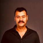 A color photo of a man.