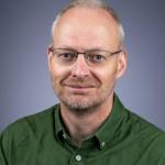 Portrait of man with glasses and graying hair 