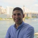 portrait of man in dress shirt, smiling at camera