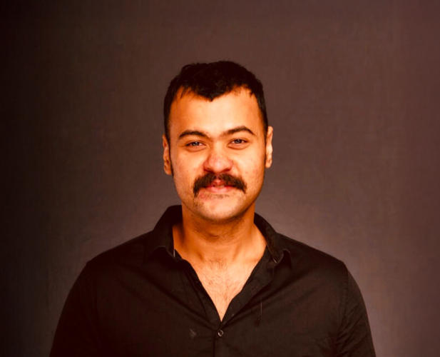 A color photo of a man.