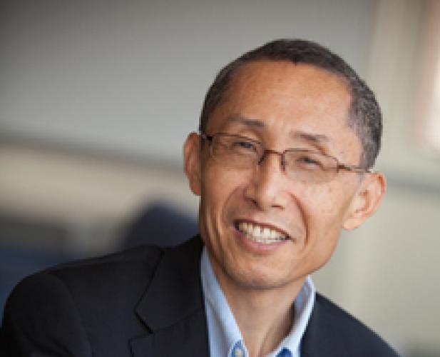 Portrait of man in suit, smiling