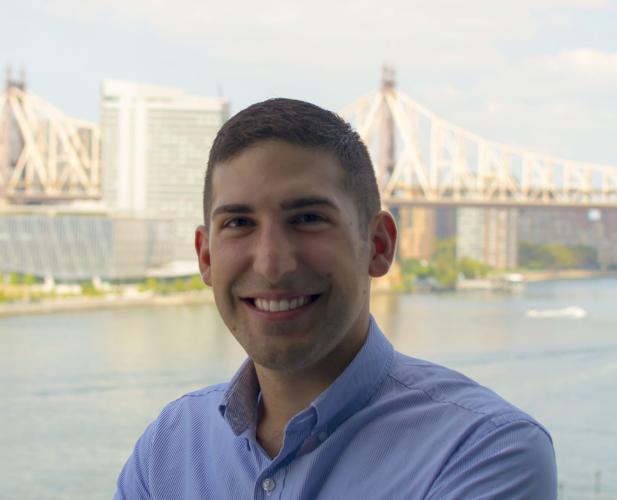 portrait of man in dress shirt, smiling at camera