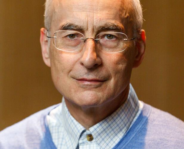 portrait of White man with short white hair and glasses 