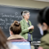 A color photo showing Liz Karns, senior lecturer in social statistics, teaching students in Integrated Data Science.